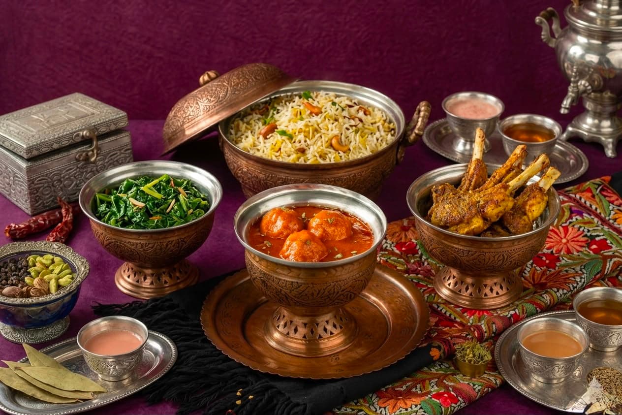 Gushtaba served in a traditional copper bowl with rice