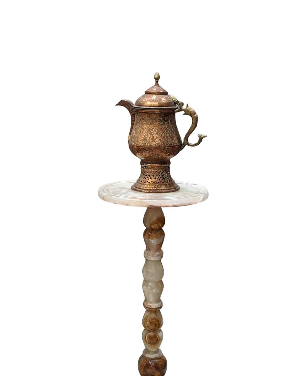 A traditional engraved copper Kahwa pot